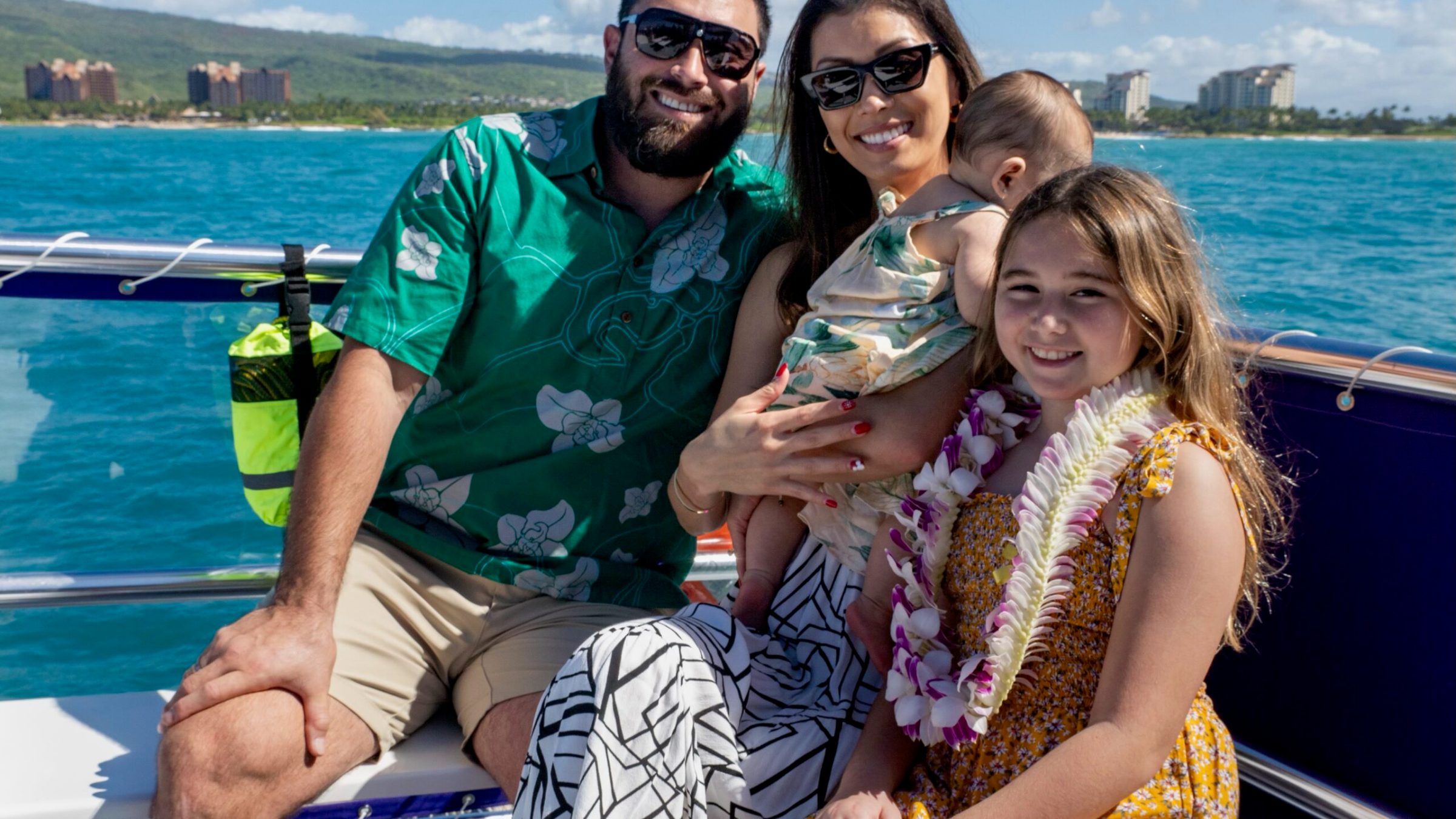 a man and woman sitting next to a body of water