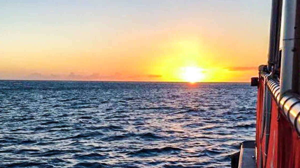 a sunset over a body of water