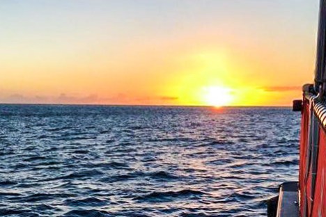 a sunset over a body of water