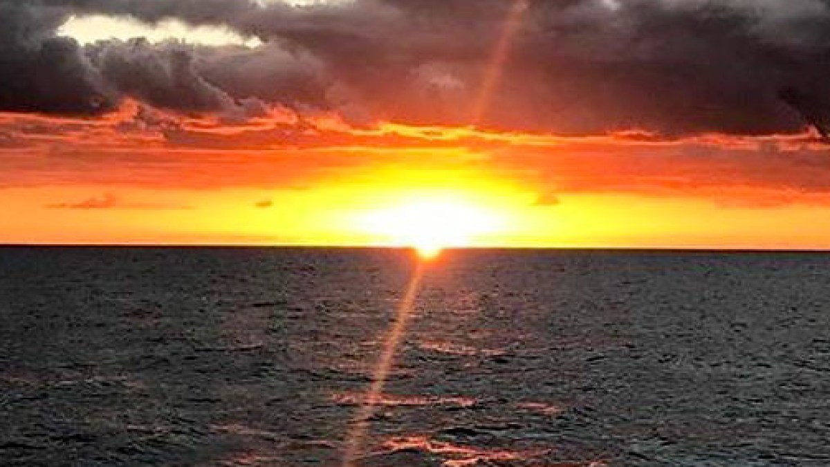 a sunset over a beach