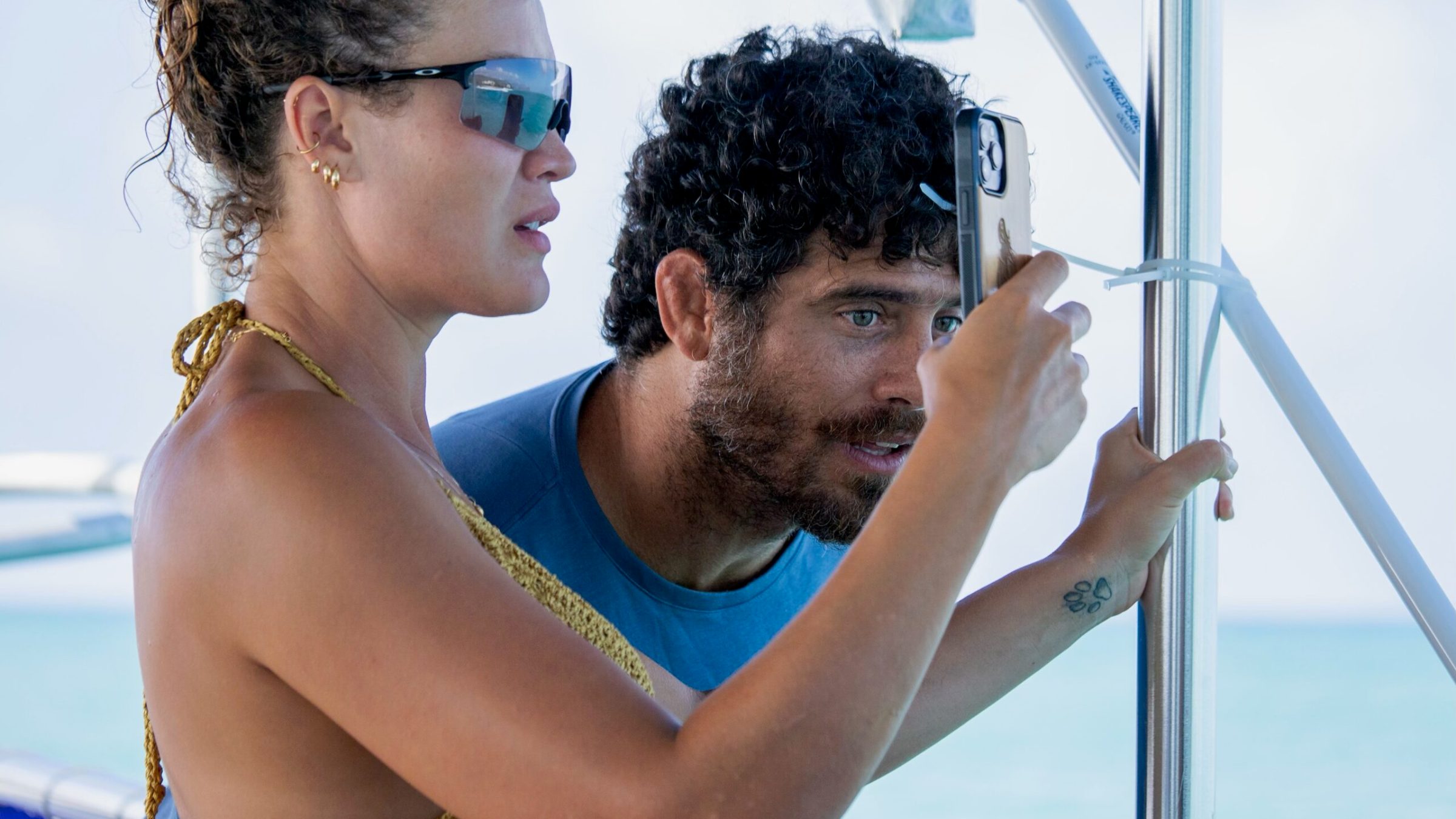 a person wearing sunglasses posing for the camera