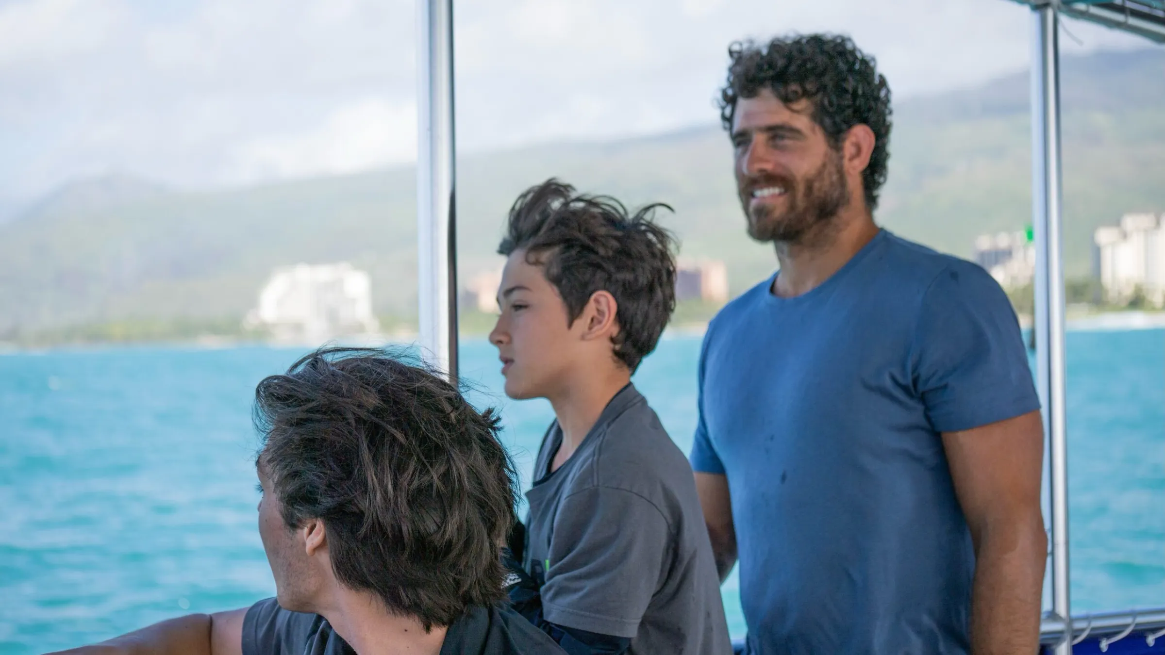 a man standing in front of water
