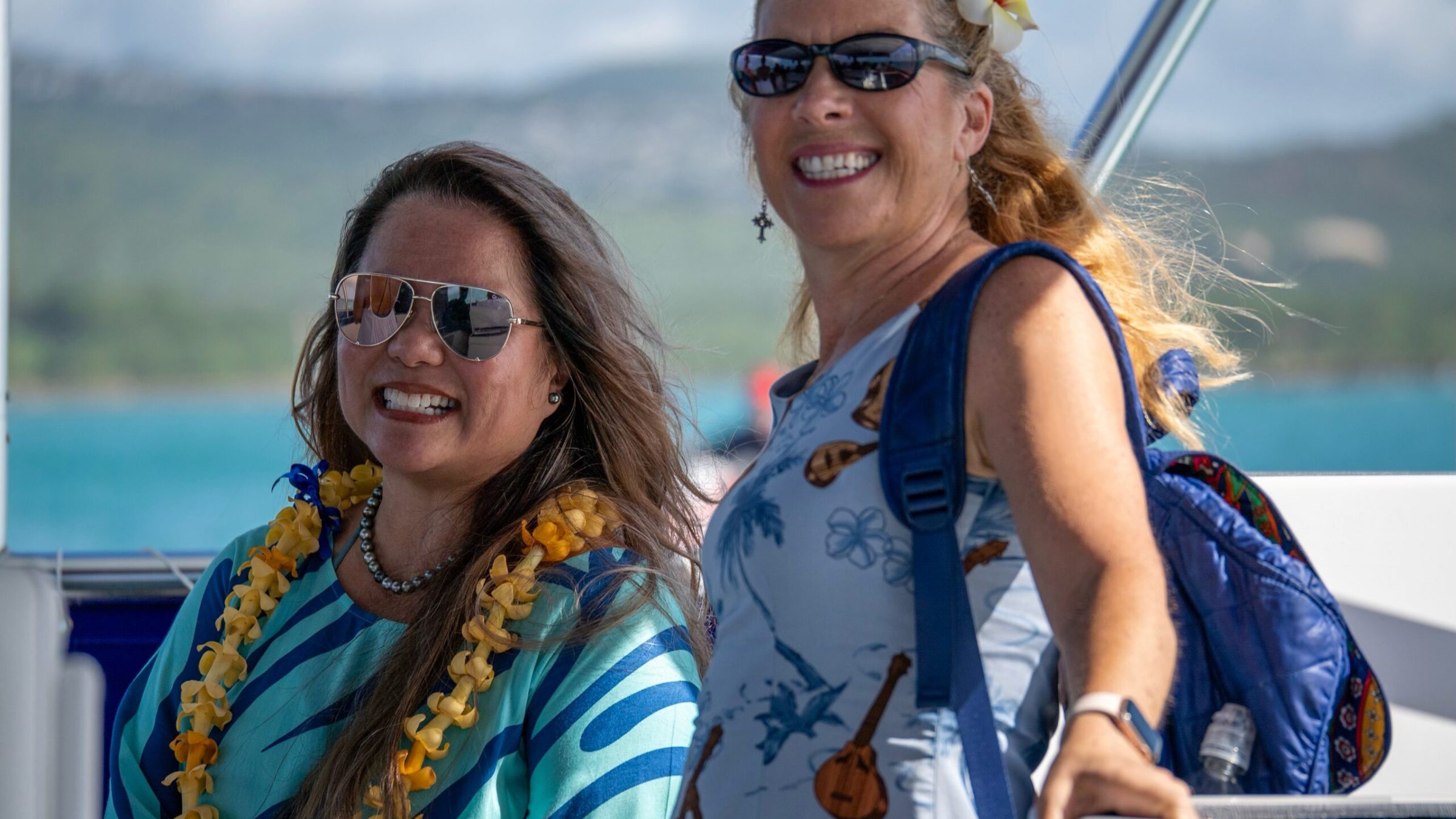a woman wearing sunglasses posing for the camera